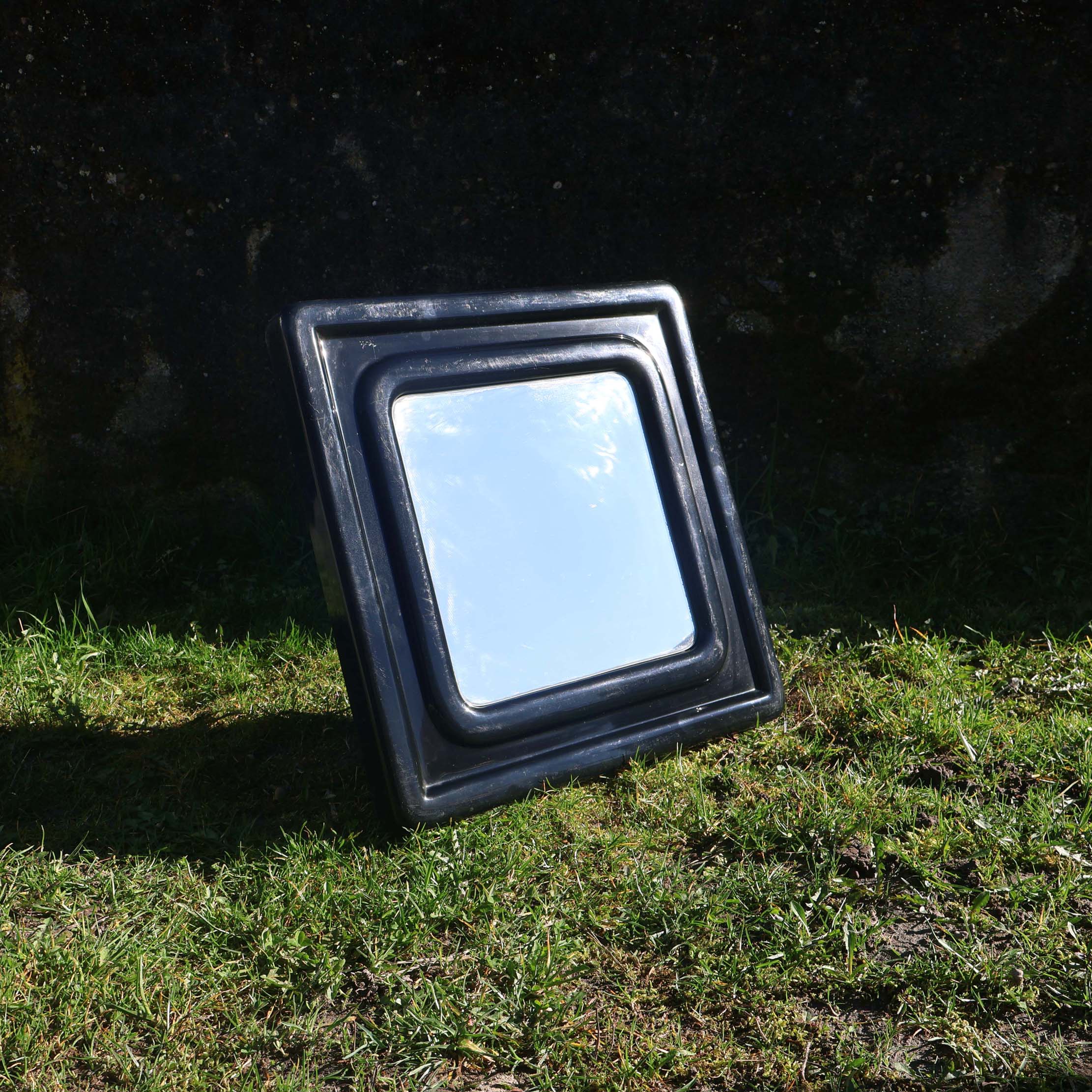 Miroir space age 1970s noir. Design vintage époque seventies