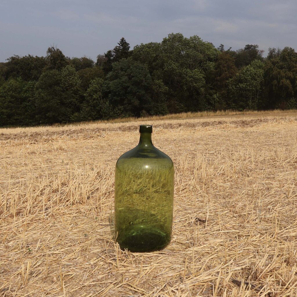 Grande bonbonne cylindrique, type Dame-Jeanne.