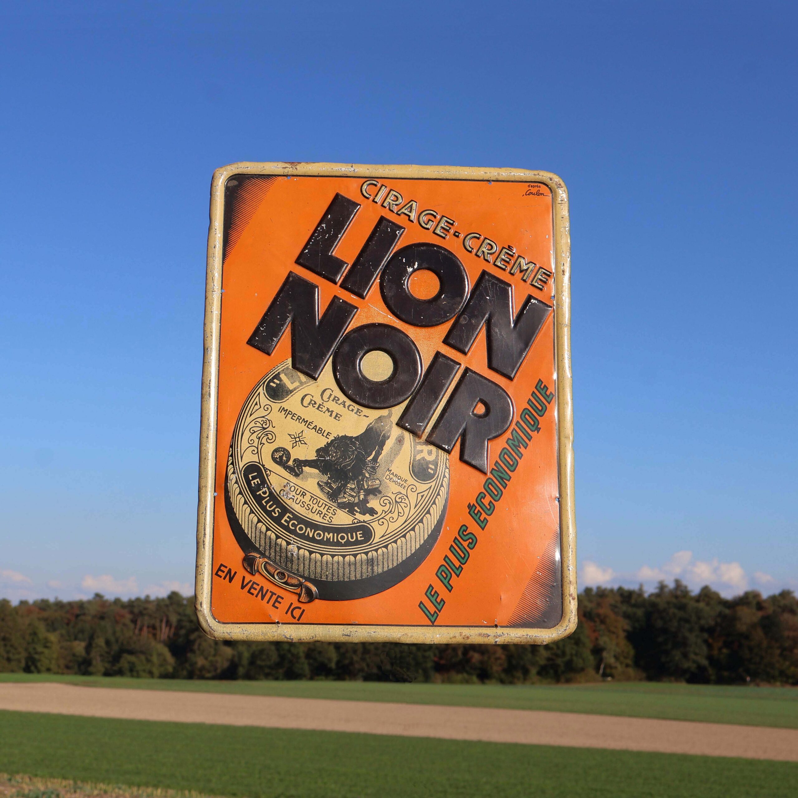 Lion Noir tôle publicitaire 1930s. Plaque de réclame imprimée